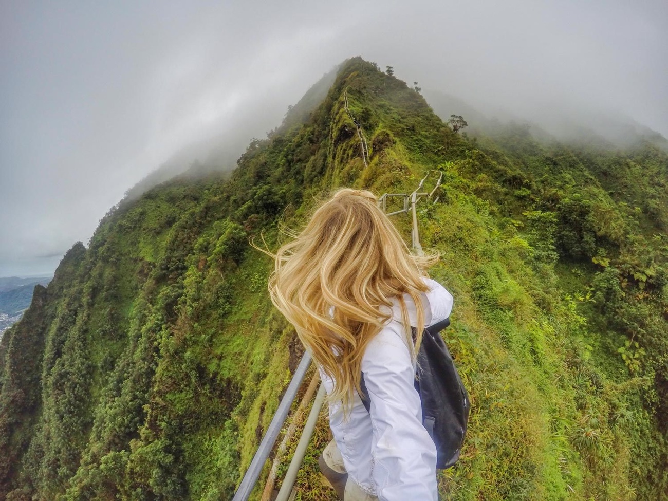 GoPro POV — hiking a misty mountain ridge